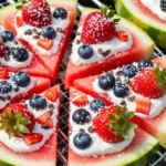 A beautifully lit close-up photograph of a sliced Grilled Watermelon Berry Pizza resting on a metal barbecue grill grate, showcasing juicy watermelon wedges loaded with a creamy dairy-free topping, fresh strawberries, blueberries, and a sprinkle of shredded coconut.